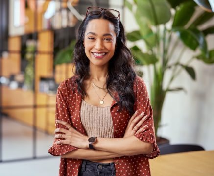 Smiling confident latin woman looking at camera