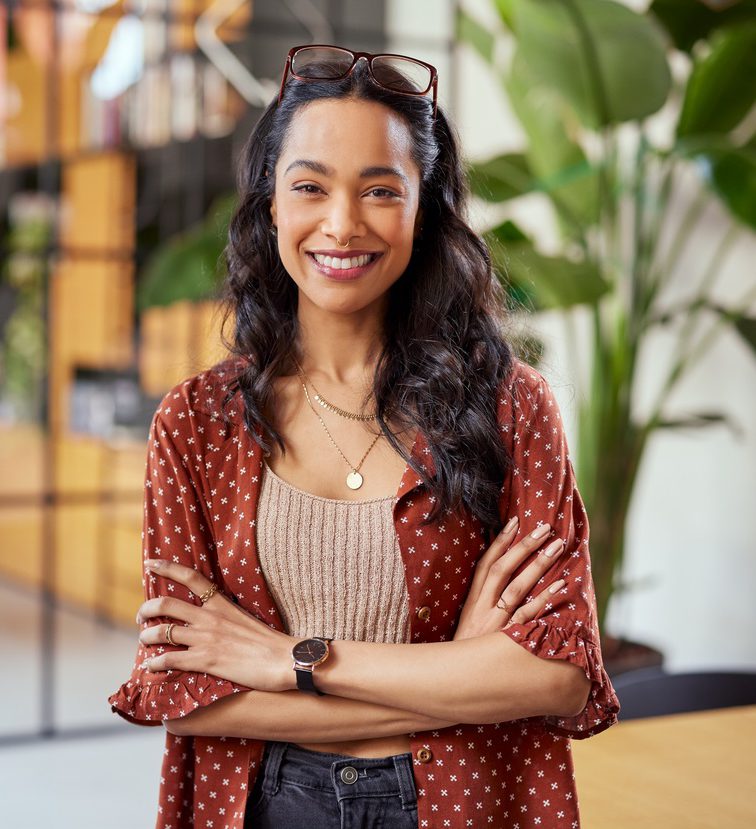 Smiling confident latin woman looking at camera
